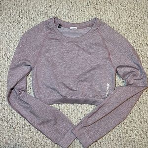 Long sleeve purple gymshark cropped shirt. Size M